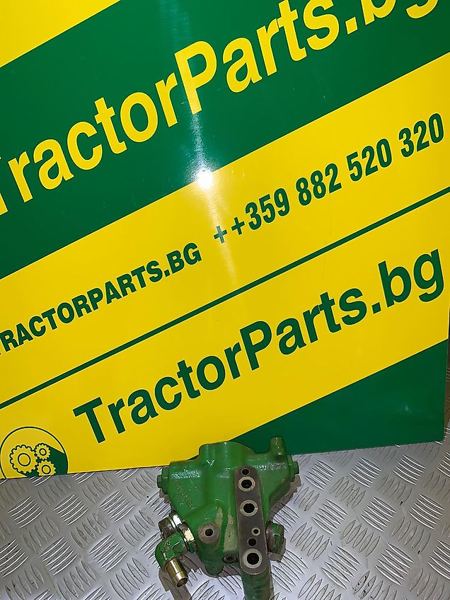 John Deere CONTROL VALVE ON THE ECLECTIC MOTOR FOR THE LINAKAGE (used) - John Deere 6M, 6MC, 6030 series